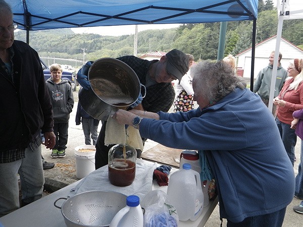 June Bowlby pours some of the wonderful cider.