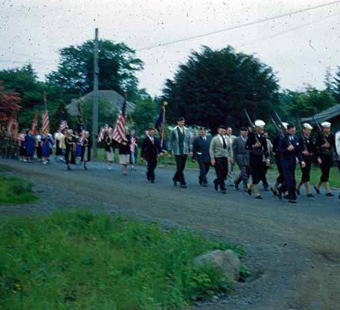 Memorial Day parade 1950-1960 marching up Calawah Way to the cemetery.