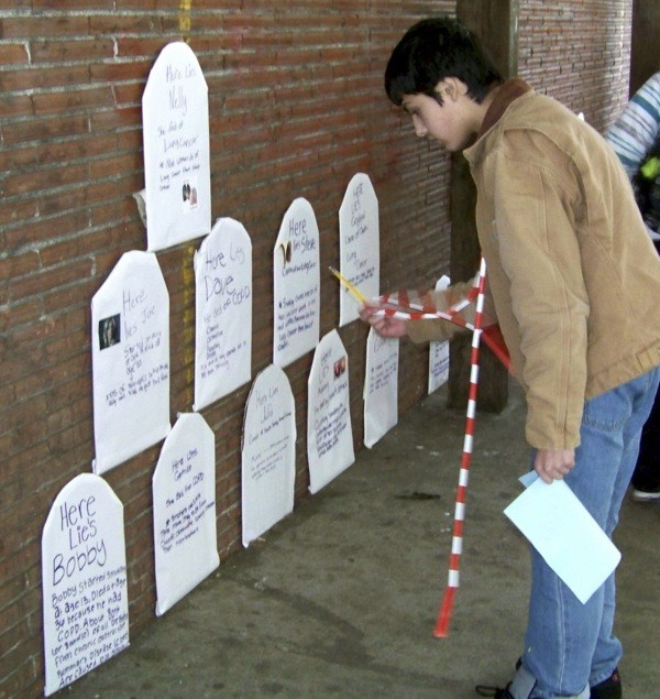 Phoenix Hestand searches for clues during the Tombstone Scavenger Hunt during the second annual Kick Butts event.