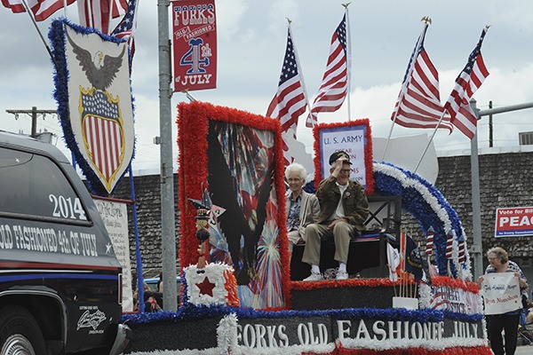 Home Town Hero Oscar Peterson rides on the Forks Old Fashioned Fourth of July Float with his wife Wilma