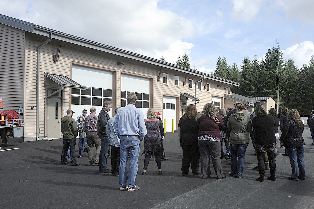 Visitors gather outside the new DNR shop awaiting the ribbon cutting and tours. Photo by Lonnie Archibald