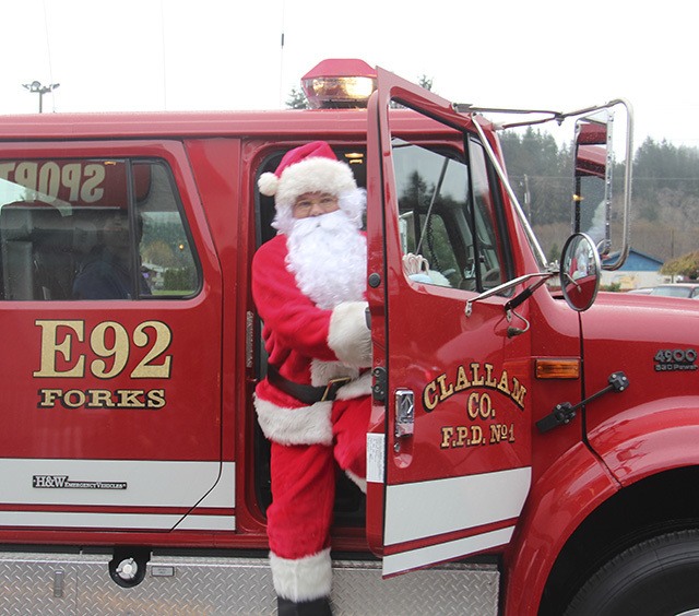 Santa arriving at Forks Outfitters last Saturday …..