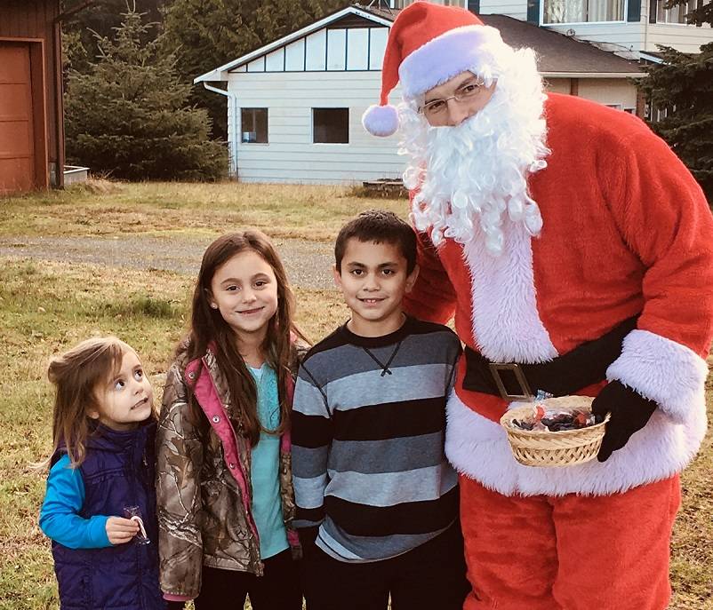 There were lots of opportunities for photos with Santa … some are a little overwhelmed to see the big guy in their neighborhood.