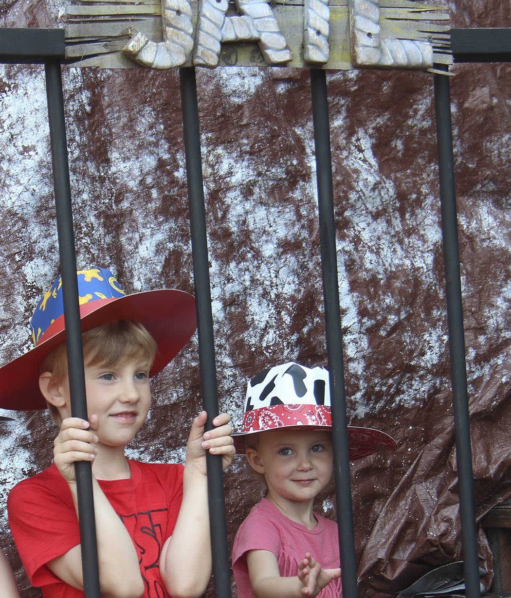 These guys are too cute to go to jail … but not too cute to have their photo taken by Glenn King and then have it printed out as a souvenir from the Hoe-down. Photos by Christi Baron