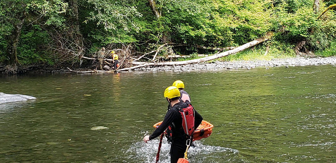 Crossing the river with equipment.