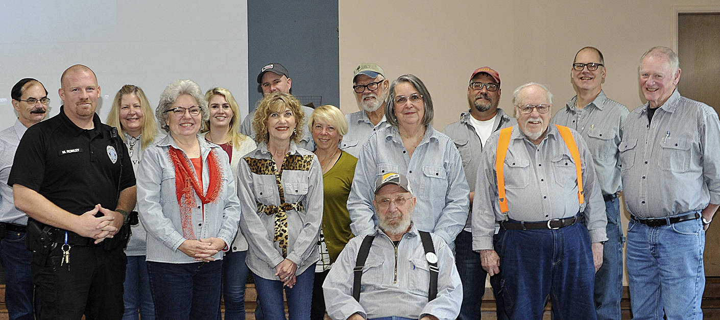 Members of the West End Business and Professional Association gathered for a group photo last Wednesday morning at the Forks Congregational Church after awarding Richard Halverson, seated front, the 2019 Pioneer Logger Award. Photo Lonnie Archibald