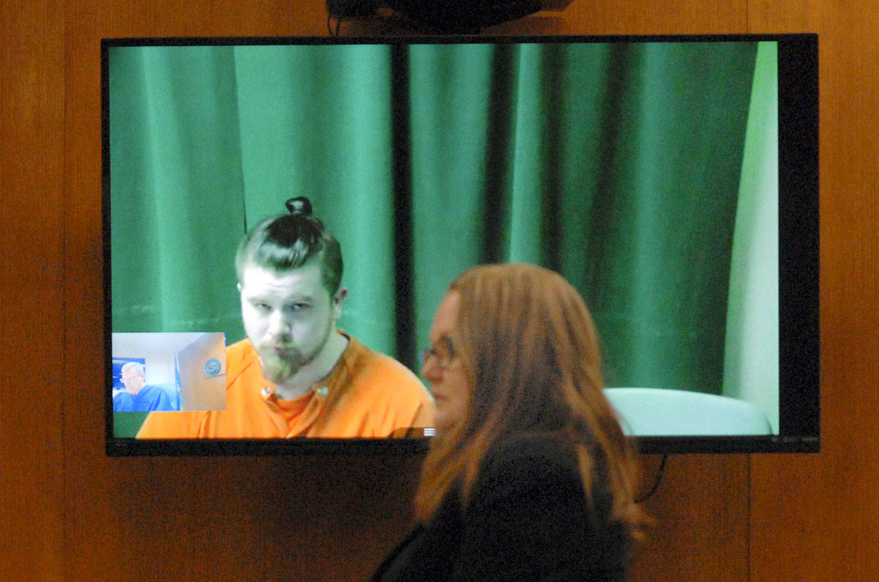 Izaiah Jamal Calloway, 20, of Forks appears in Clallam County Superior Court on Tuesday, March 24, 2020, via video link as Clallam County Chief Deputy Prosecuting Attorney Michele Devlin speaks about charging Calloway with second-degree murder in the death of his daughter, 7-week-old Faye River Raven Yates. (Keith Thorpe/Peninsula Daily News)