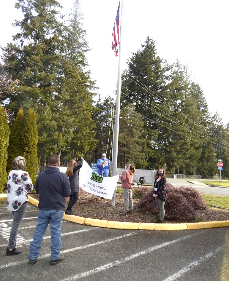 Eric Anderson FCH’s Maintenance Supervisor assists Thompson, Perkins-Peppers, and Johnson with the flag-raising last Thursday morning at FCH, as FCH Maintenance Tech Jason Dabney and Anderson look on.