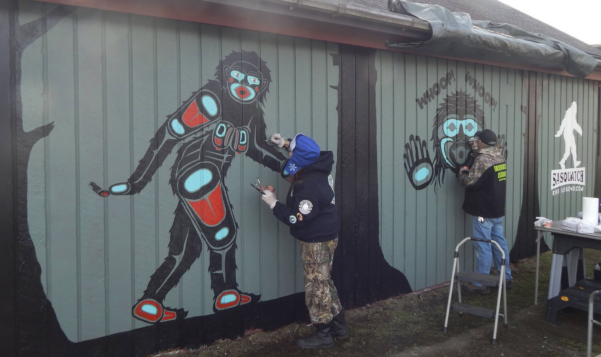 Recently Tom Sewid and Peggy Seaview created native-inspired paintings outside the recently opened Sasquatch The Legend store on Forks Avenue. Photo Christi Baron