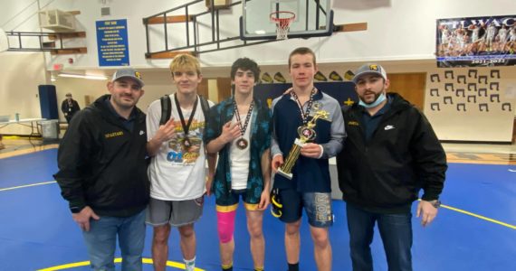 Individual Champs with coaches left to right: Coach Weakley, Jake Weakley 152 lbs, Walker Rondeau 132 lbs, Nate Dahlgren 170 lbs, and Coach Fishkorn.