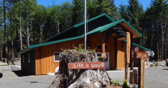 This building sits as you enter the new campground. Eventually, it will be open as a retail space. In his spare time, Buonpane likes to carve and create wooden items and other things, which he will offer for sale as well as a place for tourist information publications. The stump featured out front is chared a bit from the Great Forks Fire of 1951 which took this path as it headed for Forks! Check out hipcamp.com for more information. Photos Christi Baron