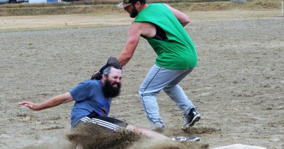 Dayne Brown of Team Gramps was called safe at third as Mossquatch third baseman David Hurn made the tag. Gramps took this contest 21 to 11.