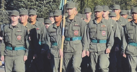 Devlin leading his Spartan platoon. He has earned the honor of carrying the flag.