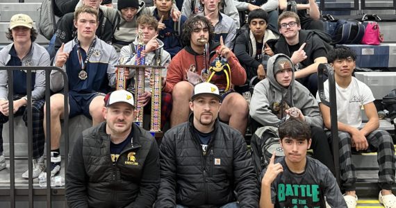 The Forks boys wrestling team celebrates its first-place finish at the Sgt. Justin Norton Memorial tournament held last weekend in Rainier. It is the second straight year the Spartans have won the tournament and it is the sixth tournament the boys have won this season. (Courtesy photo)