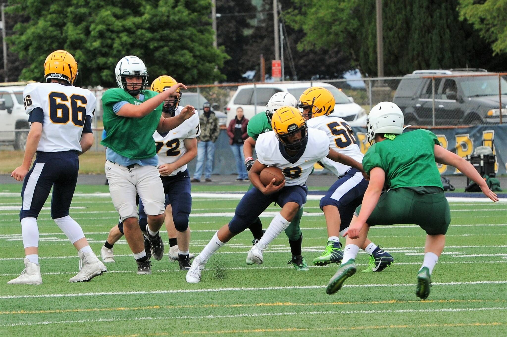 Spartan QB Bubba Hernandez (8) in route to a touchdown against Port Angeles. Also in on the action are Spartans Jack Delgado (66), JJ Hutto (72) and Edwin Black (56) Photo by Lonnie Archibald