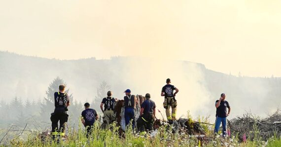 Firefighters take a moment …Photo Mike Z