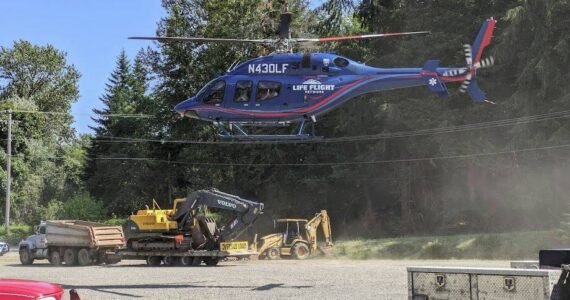 A medical airlift helicopter prepares to land near the scene of an accident south of Forks on Saturday afternoon. A Seattle man who was involved was airlifted to Harborview. Submitted Photo