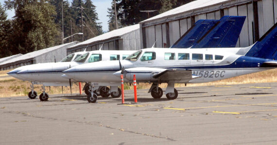 Three Dash Air Shuttle Cessna 403C aircraft sit parked at William R. Fairchild International Airport in August 2021 as they await entering into scheduled service between Port Angeles and SeaTac Airport. (Keith Thorpe/Peninsula Daily News)