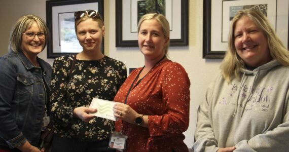 L-R Forks Community Hospital CEO Heidi Anderson, local author M. B. Thurman, FCH Foundation VP Cassie Howell, Executive Director Forks Chamber of Commerce Lissy Andros. Thurman presents Howell with $4,000 raised at a pre-Forever Twilight in Forks event in September. Funds raised will benefit the purchase of a new Mammography machine for the Forks Hospital. Photo Christi Baron