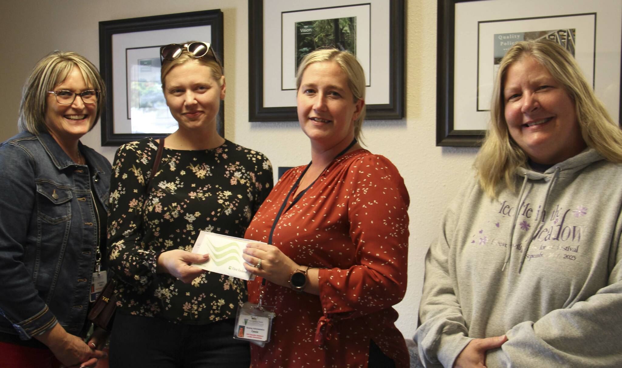 L-R Forks Community Hospital CEO Heidi Anderson, local author M. B. Thurman, FCH Foundation VP Cassie Howell, Executive Director Forks Chamber of Commerce Lissy Andros. Thurman presents Howell with $4,000 raised at a pre-Forever Twilight in Forks event in September. Funds raised will benefit the purchase of a new Mammography machine for the Forks Hospital. Photo Christi Baron