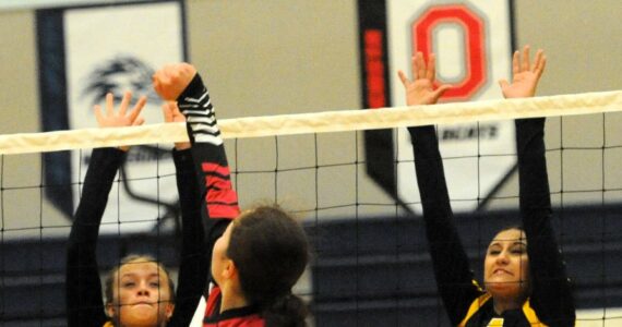 In JV volleyball action Tuesday, Sept. 26 Spartans Riley Tjepkema (6) and Kailani Gorum (4) go for the block against Neah Bay who Forks defeated 2 to 1. Photo by Lonnie Archibald