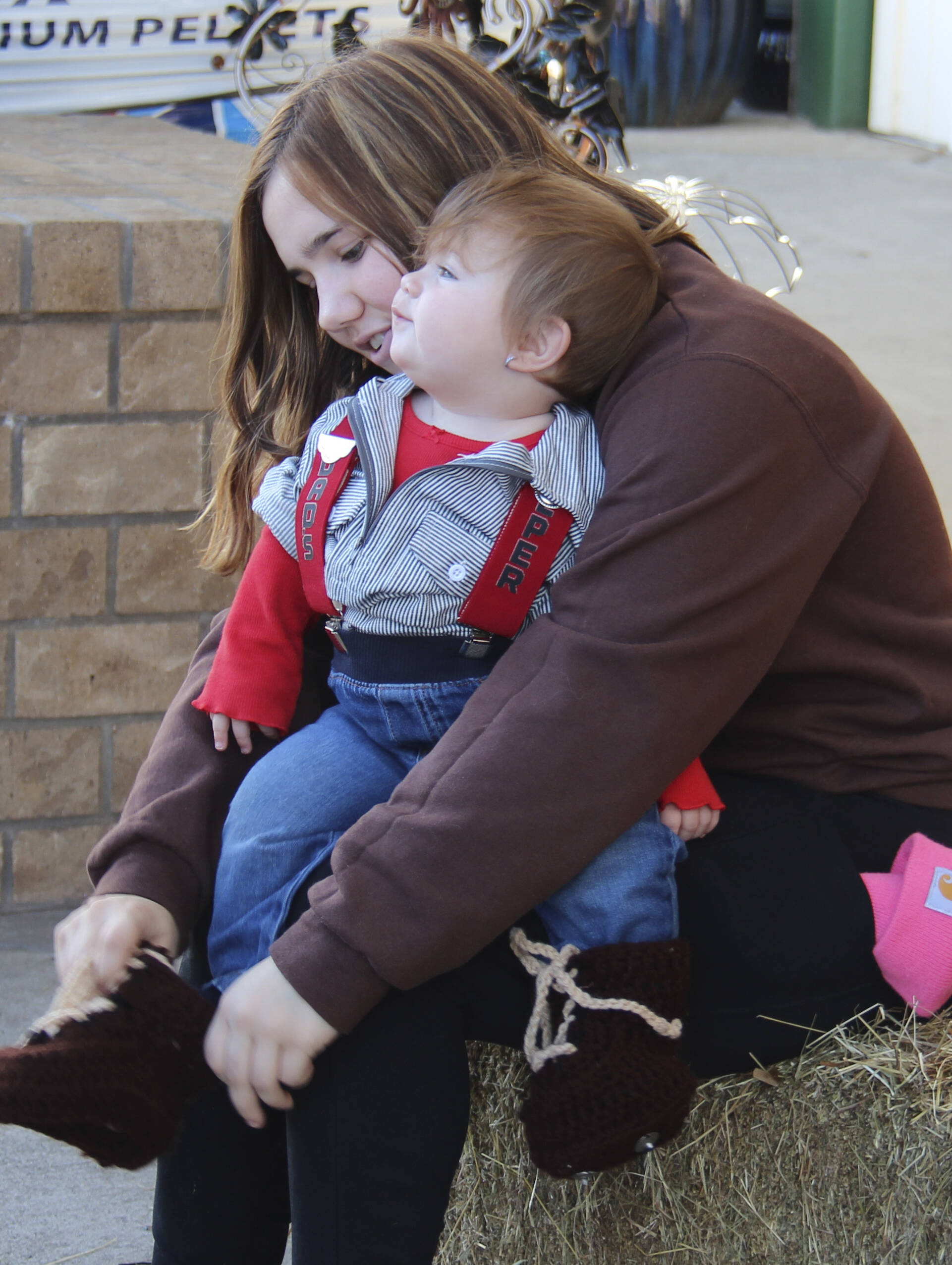 Mom Aspen puts on Ivery’s custom-crocheted caulk boots! But they didn’t want to stay on. Ivery won a $15 gift card.