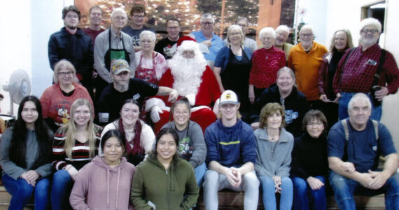 Community members ages 15 to 50-plus took time to volunteer at the annual Breakfast with Santa last Saturday. Church members/volunteers cooked the breakfast, students from the FCCLA/FHS Culinary Class helped serve, and WEBPA members manned the door and took and printed photos. When it was all over … a group photo! Submitted photo