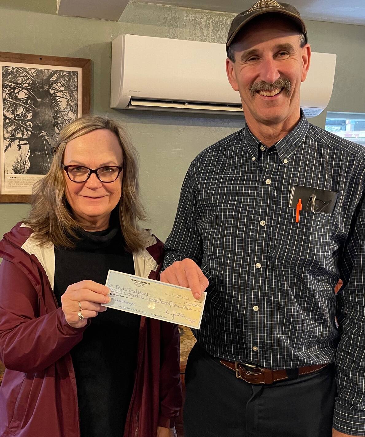 If you gave at the check-out stand at Forks Outfitters over this past holiday season … Congratulations! you helped raise $7,673.06 for our local Food Bank. Outfitters owner Bruce Paul said it was one of the biggest donations he can remember, “We give incentives to the checkers to help raise the money, so they really have fun with it.” Paul recently presented Forks Food Bank Executive Director Pat Soderlind with the check. Photo Christi Baron