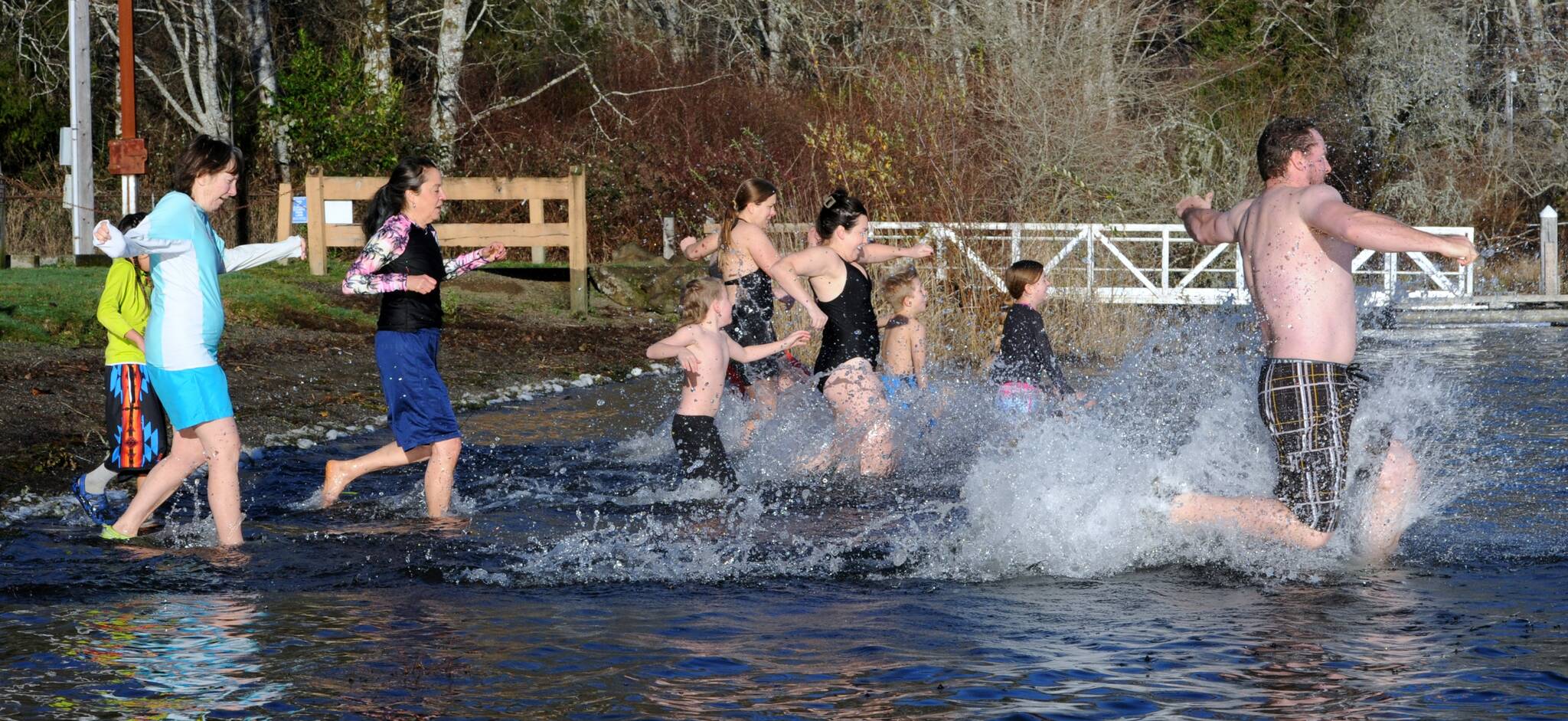 With frost on the lawn, these brave souls entered the cool waters of Lake Pleasant on New Year’s morning in the annual polar bear plunge. Photo by Lonnie Archibald