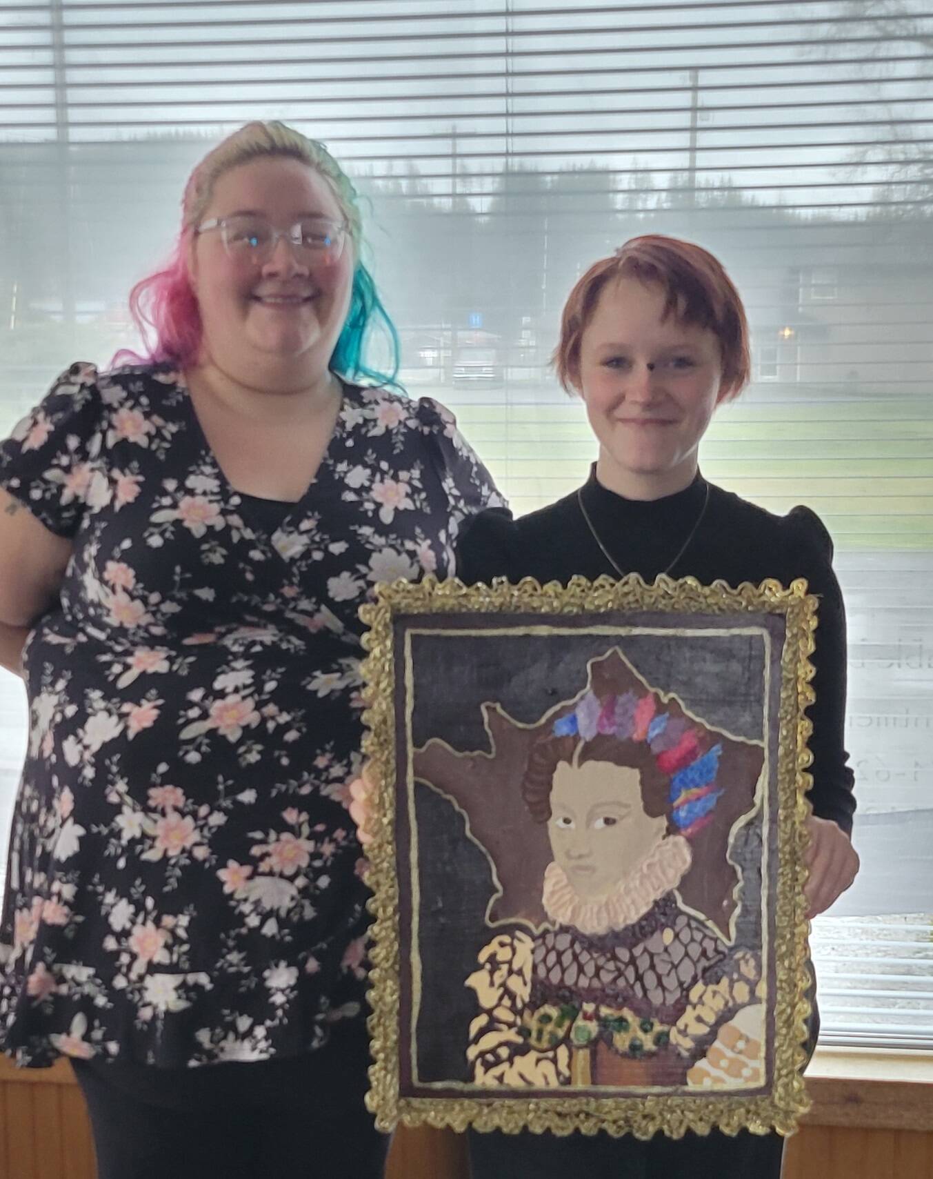 Kelsey and Amara with her art. In recognition of her achievement, Amara received a certificate and a coffee gift card. Submitted photo