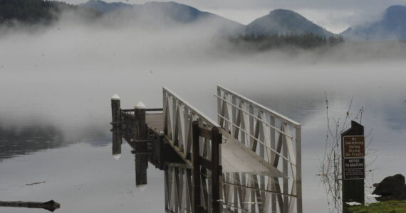 Two weeks ago in the Forks Forum, ice was seen covering the ramp to the float at Lake Pleasant’s Clallam County Park. By Saturday, Jan. 28 high water replaced the ice as rains came hard during the previous day and Sunday saw a high of close to 60 degrees. Over 4 inches of rain fell over the weekend. Pictured here the lake had risen partially covering the walkway to the float. Photo by Lonnie Archibald