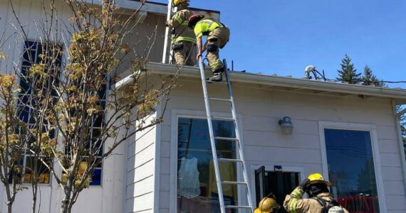 CCFPD#1 firefighters head up on the roof at Ginger’s Closet located at 170 Sol Duc Way. Submitted photo
fire