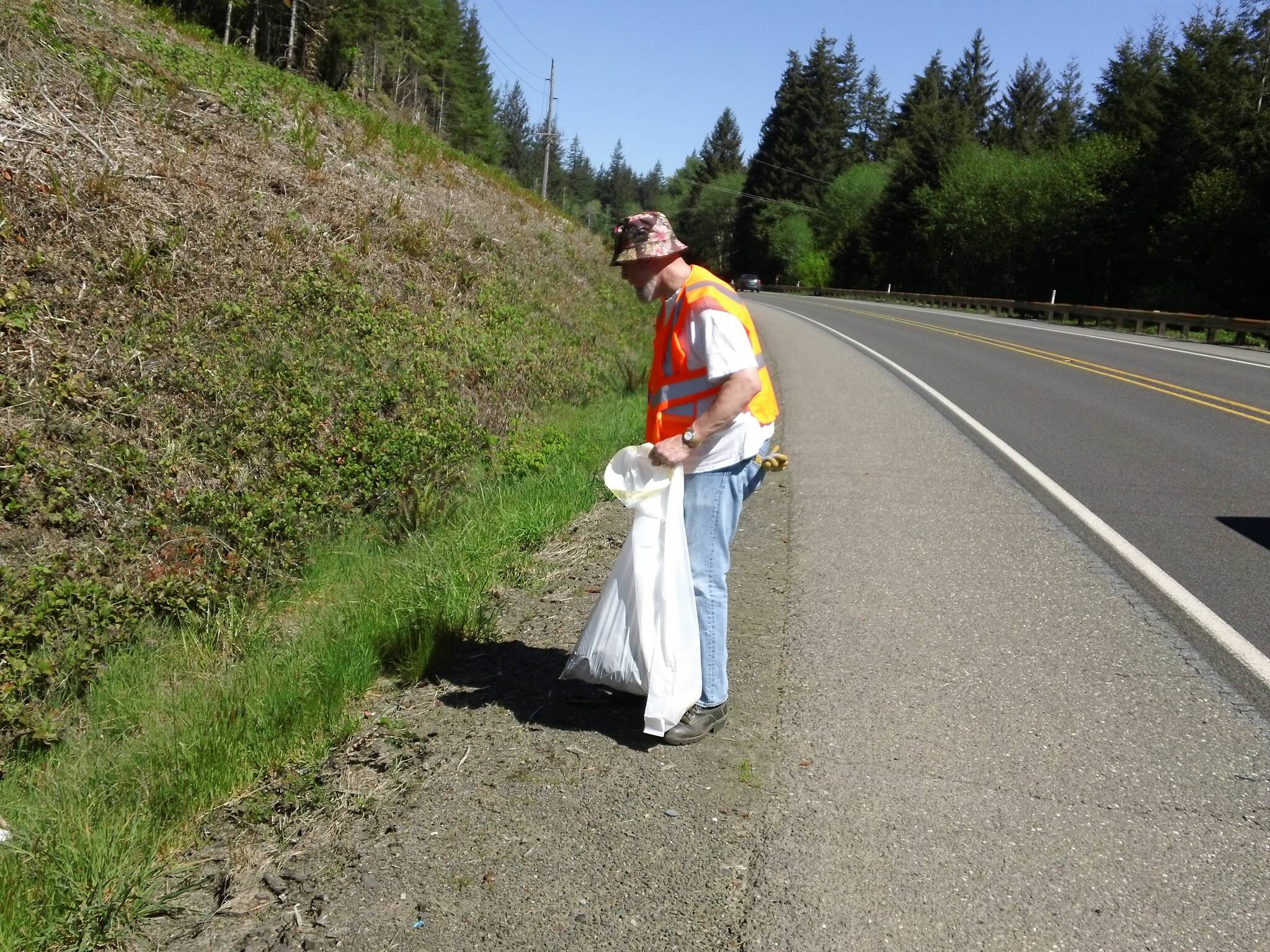 Members of the Forks Elks Lodge picked up trash on Highway 101 near Shuwah Road on March 11. Heather, Ian, Rufus, Bill, and Andrew took part in the activity. Here Rufus works some of the roadside area.
Submitted photo