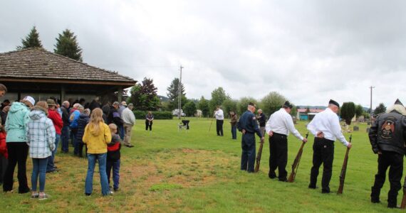 A good-sized crowd joined in a moment of prayer as they came out to remember those lost while in service to our country. Photo Christi Baron