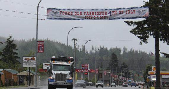 For the first time in MANY years, we have Forks Old Fashioned 4th of July banners at both ends of town!
Thanks to Laurel Black Design of PA for design work, Strait Signs of Sequim for building and printing the banners, and the Lloyd J. Allen Charitable Trust Fund for funding the project! And the City of Forks public works department for getting them up! A Forks Forum Facebook follower shared that High School Art Department teacher Ron Thompson, and students, created a 4th of July highway banner with canvas that the US Coast Guard Recruitment Center donated sometime in the late 1970s.
Photo Christi Baron