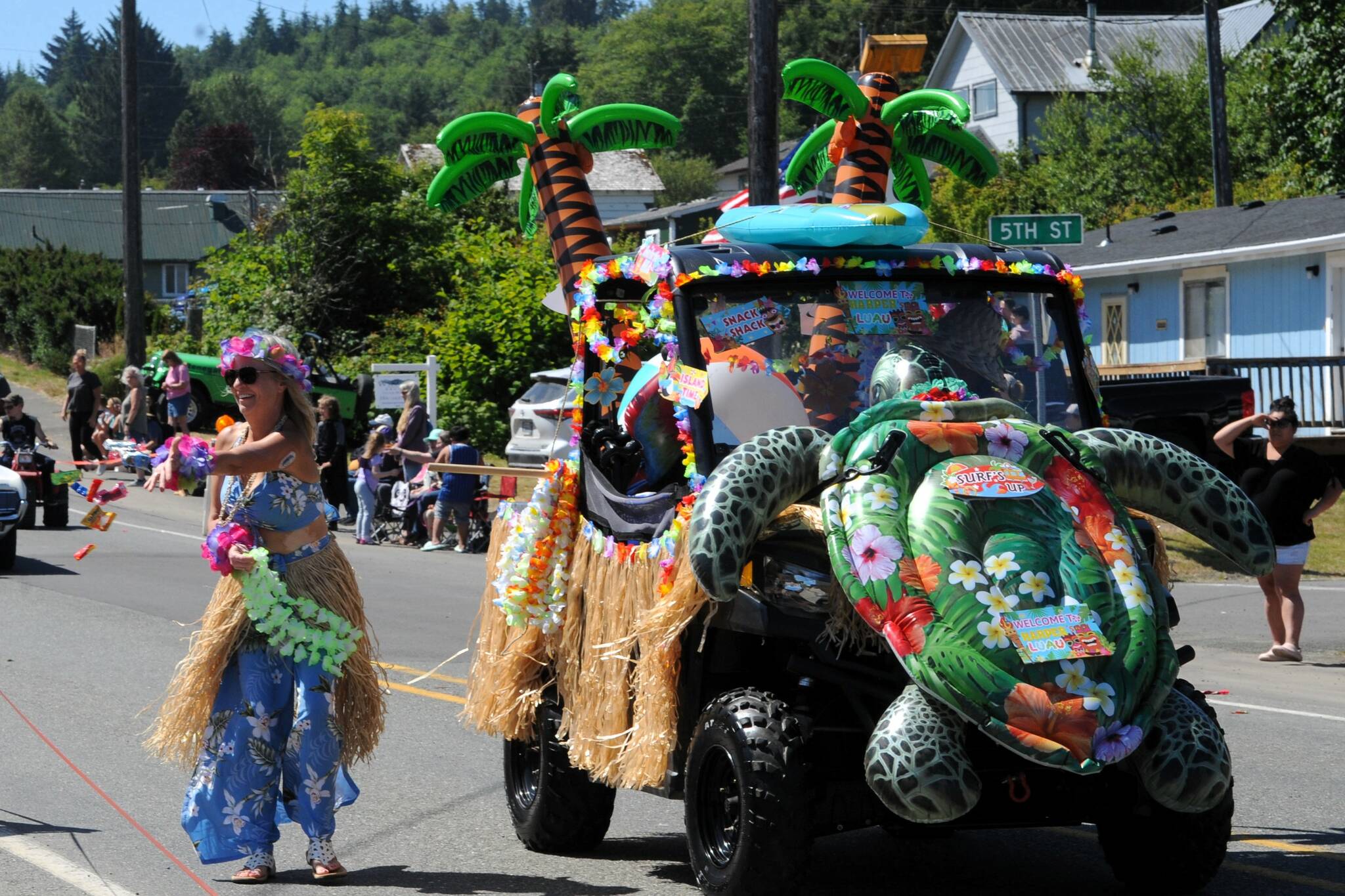 Marcia and Mark Hess with their Aloha float. Photo by Lonnie Archibald