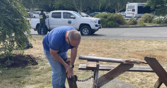 Who ya gonna call …when the picnic table you go to sit on just falls apart? While doing a garden club project last week Janet Hughes and Linda Wells discovered this table had seen better days …a quick call to City Hall and it was Paul Hampton, Public Works Director, on the scene to pull it apart and load it up! Photo Christi Baron