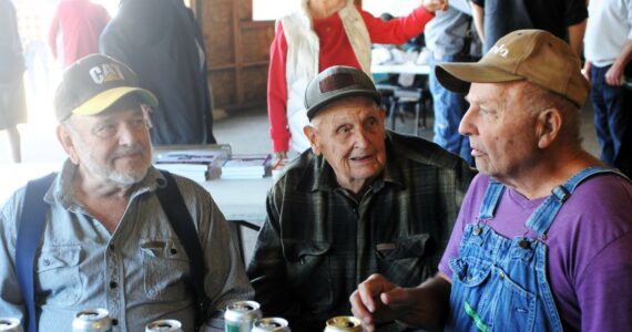 Del, Clark, and Louie talked over old times last year at the annual Logger and Trucker Picnic at the Roundhouse. Photo Lonnie Archibald