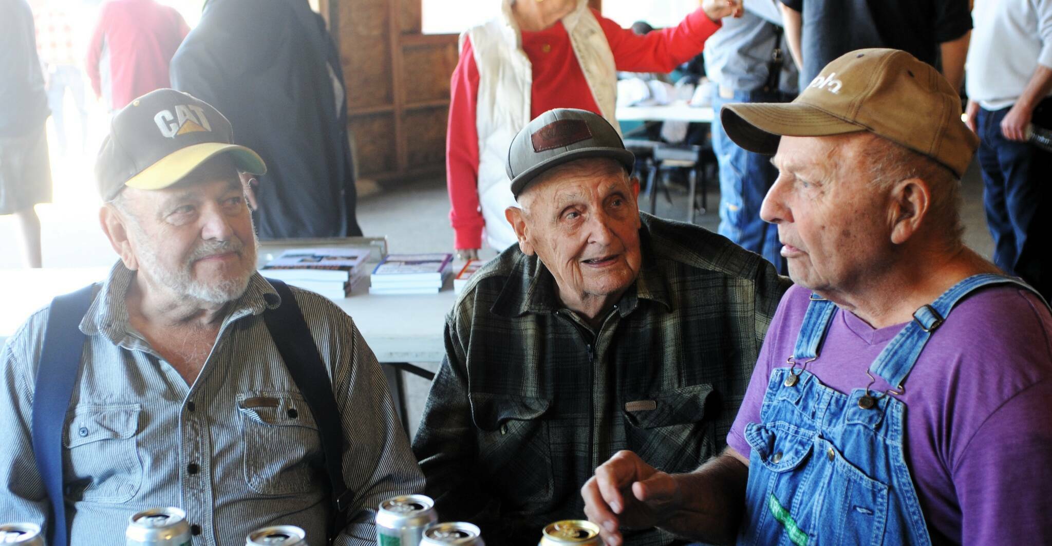 Del, Clark, and Louie talked over old times last year at the annual Logger and Trucker Picnic at the Roundhouse. Photo Lonnie Archibald