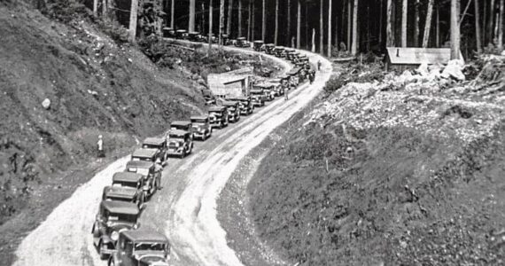 Mass vehicles headed to the Hoh River Bridge as the Olympic Loop opened south in August 1931.