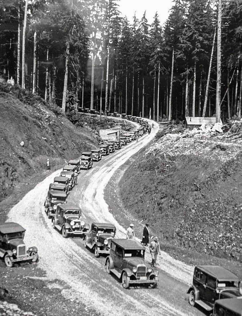 Mass vehicles headed to the Hoh River Bridge as the Olympic Loop opened south in August 1931.