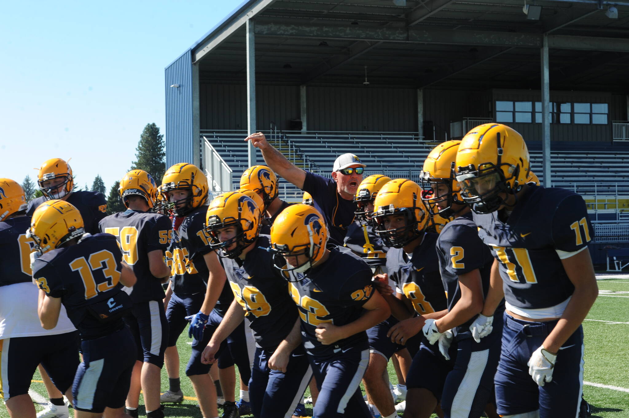 Spartan head coach Trevor Highfield instructs players at Spartan Stadium during practice. Photo by lonnie Archibald