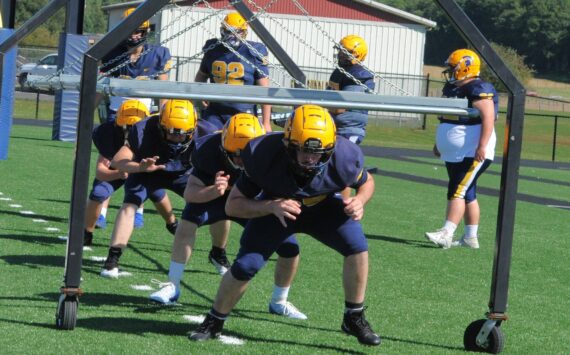 Forks High School linemen go through drills in preparation for the upcoming football season. Photo by Lonnie Archibald