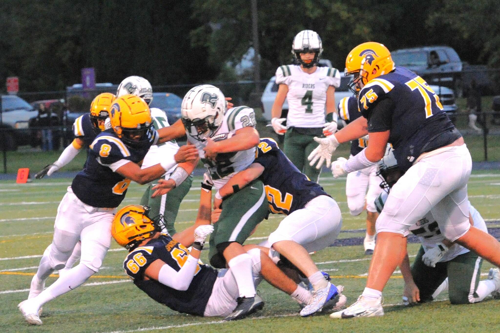 The Spartans displayed a strong defense against the Roughriders allowing only one touchdown. Pictured here on defense are Forks players Emmanuel Hernandez-Stansbury (8), Juan Terrones (66), Jeremy Hutto (72) and Kenny Daman (75). Photo by Lonnie Archibald