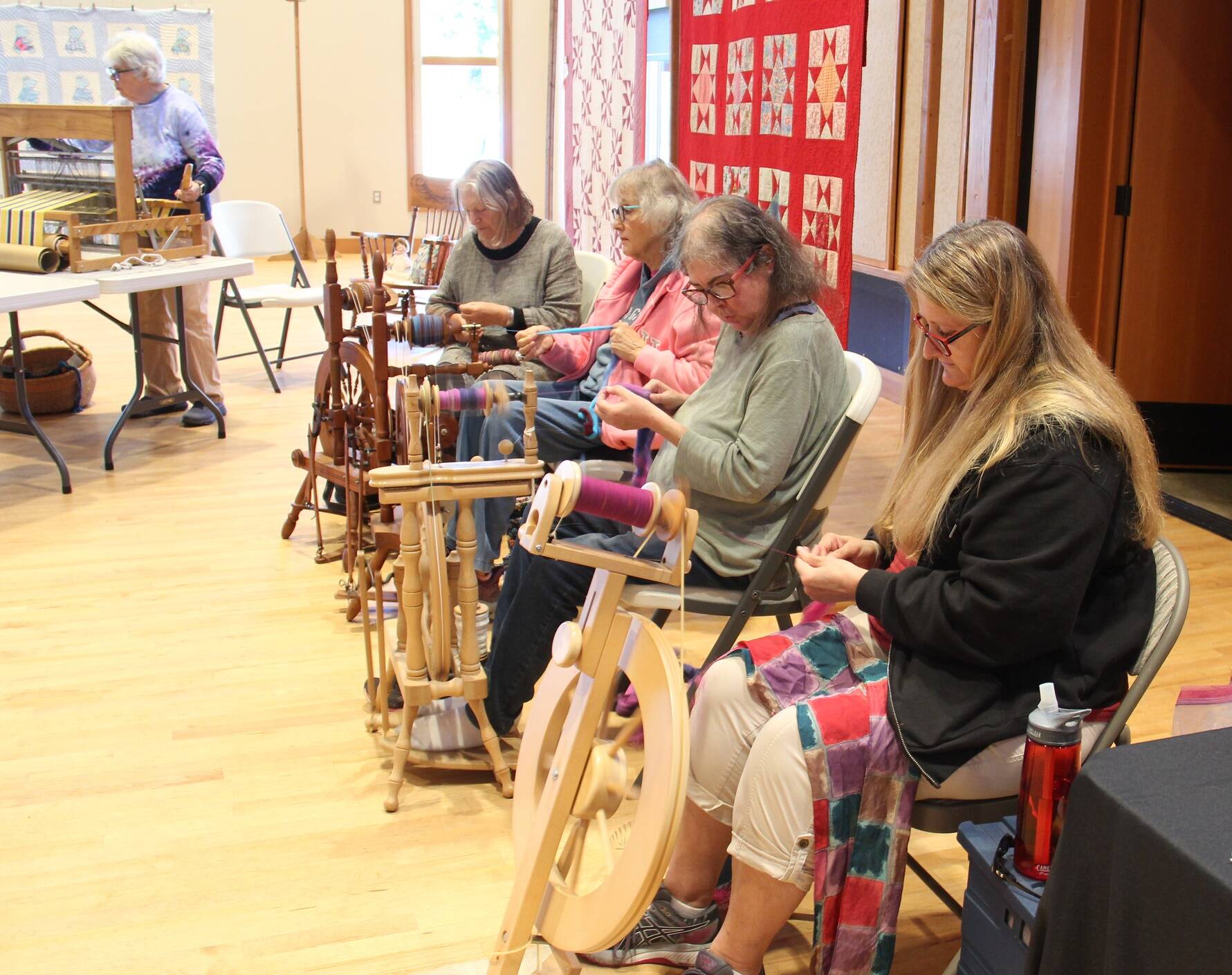 Spinners and weavers demonstrated their art form at the RAC while people mingled about during the day on Saturday.