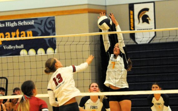 It was the story of the comeback kids on Sept. 24 in the Spartan gym as Forks who kept falling behind came back to defeat Hoquiam 3 to 2 in this non-conference contest. Pictured, here Forks’ Karee Neel goes for the block against Hoquiams’s Piper Stankavich. Looking on are teammates Bailey Johnson and Erika Williams. Photo by Lonnie Archibald