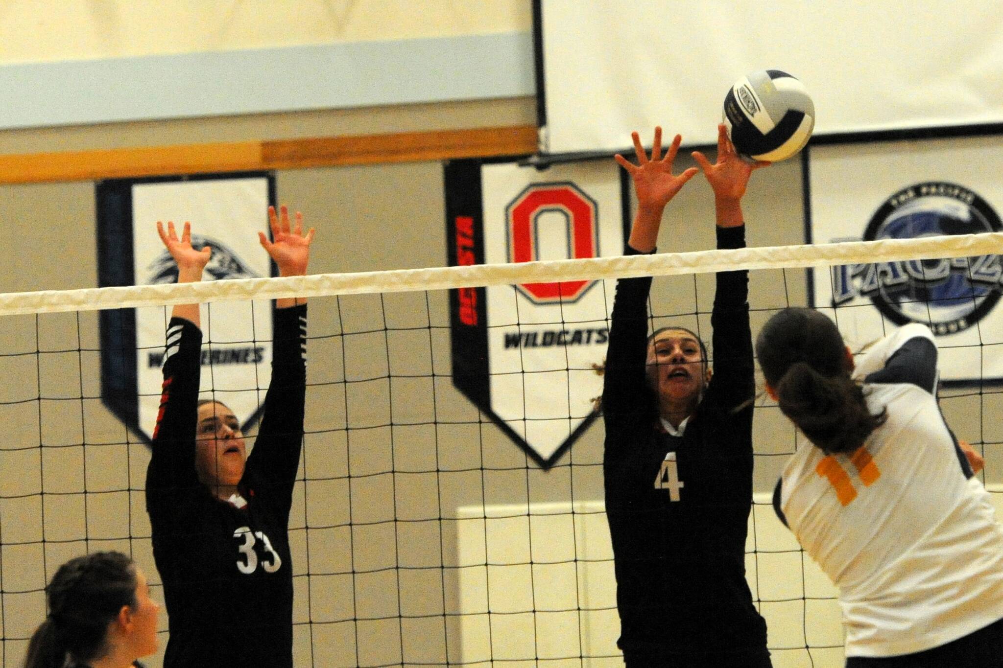 Red Devil Wiinuk Martin (33) goes for the block against Spartan Avery Dilley (11).