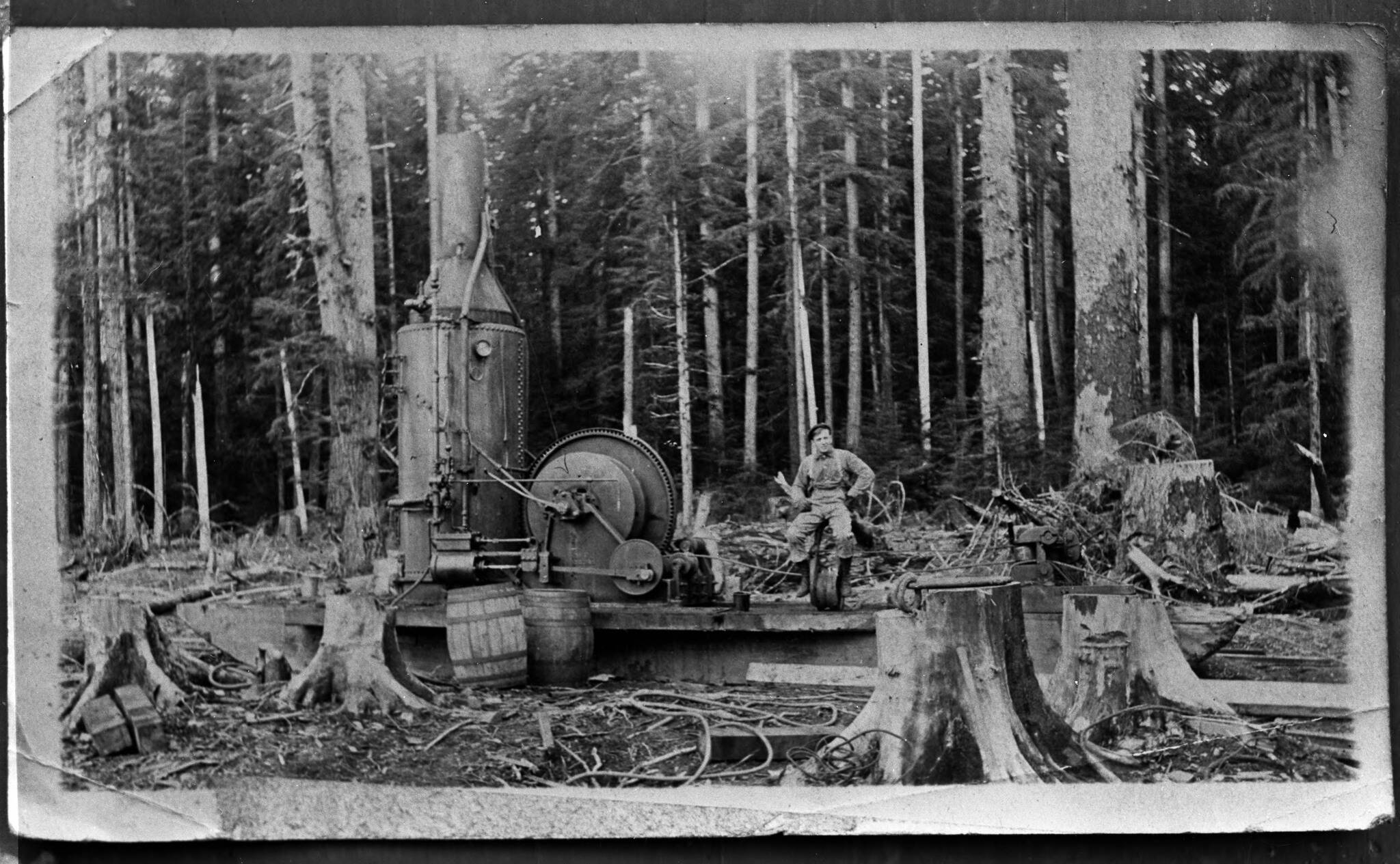 There will be two chances to enjoy a narrated video presentation of logging history on Oct. 11 and 12 at West End NOLS branches. Here an unidentified man is seated on a single-drum donkey engine, Forks. Late 19th to early 20th century; Bert Kellogg Collection.