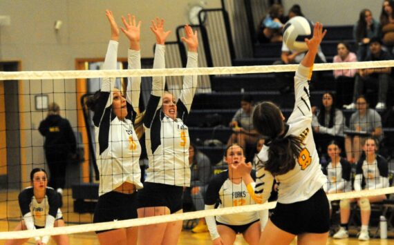 There was a lot of hustle and some great saves shown by both teams at the Spartan Gym on Thursday, Oct. 11 where Forks defeated North Beach 3 to 0. Pictured here going for the block are Spartans Avery Dillley and Keana Rowley. Backing up the play are Chloe Gaydeski (6) and Fyn Peters (12). Photo by Lonnie Archibald