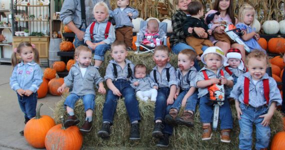 It took a few tries and not every little logger made it into the group photo …but here they are! It was a great turnout on Sunday for the Little Logger Contest 2024. Almost 20 little loggers showed up in their best logging-duds some even with glitter and some brought their little chainsaws. One little logger required real logger Dad support and the little lady logger in pink overalls just had enough and nodded off.
All little loggers got a bag of treats and a Little Logger Lottery drawing selected the winners (it is too hard to judge them). Thanks to Sully’s for the donation of ice cream cone certificates. This event was sponsored by the Forks Forum. Photo Christi Baron